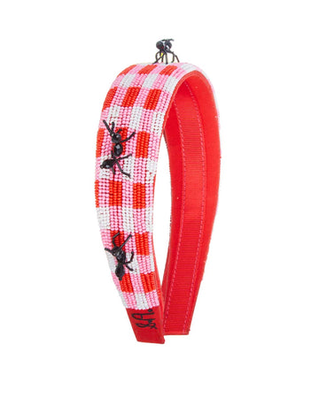 side view of white and red checkered beaded headband with beaded ants