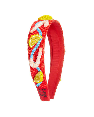 side view of red beaded headband with beaded shrimp and lemon slices