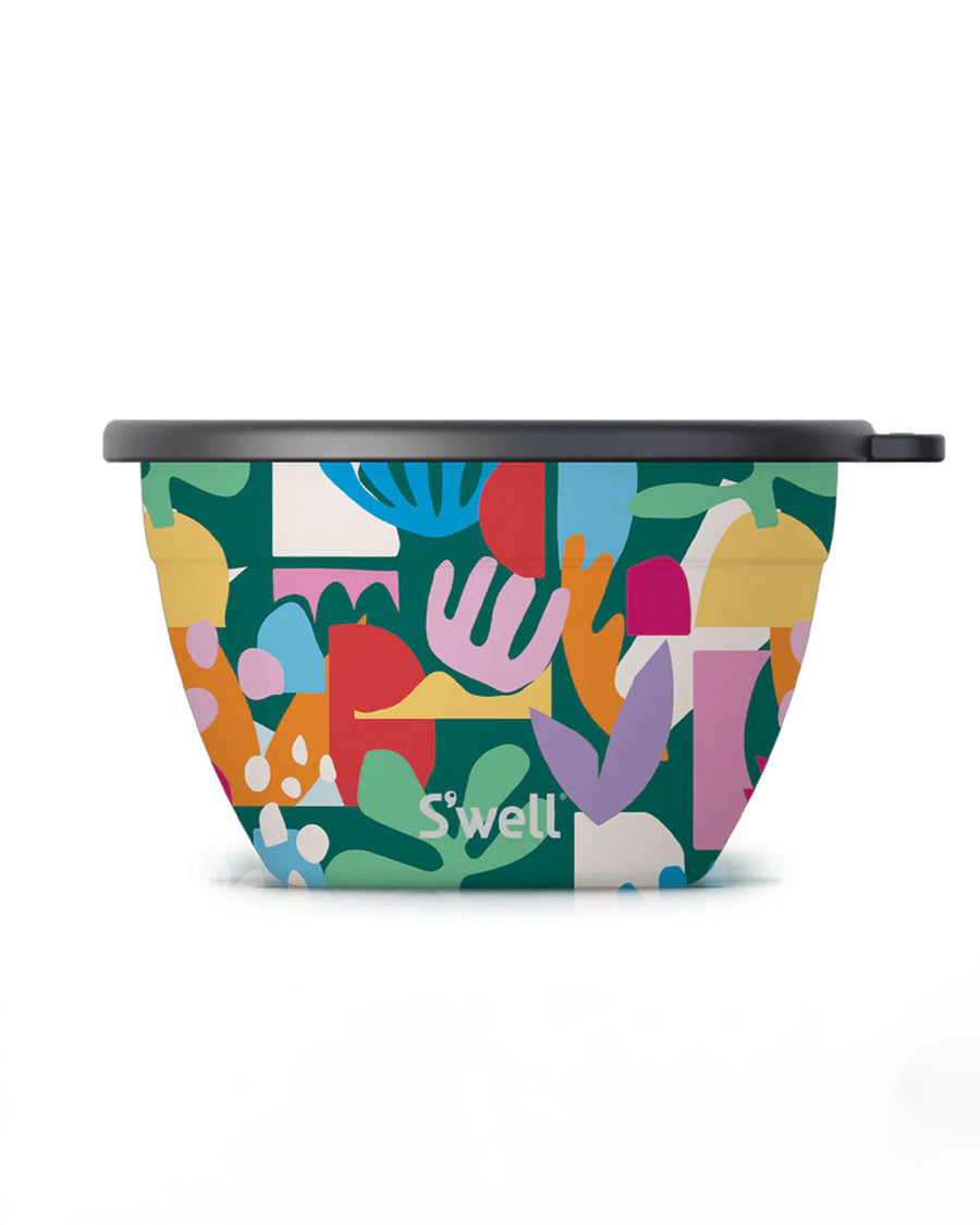 green salad bowl set with colorful 'paper cut out' shapes and smaller container for dressing