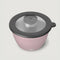 top view of light pink salad bowl set and smaller container for dressing