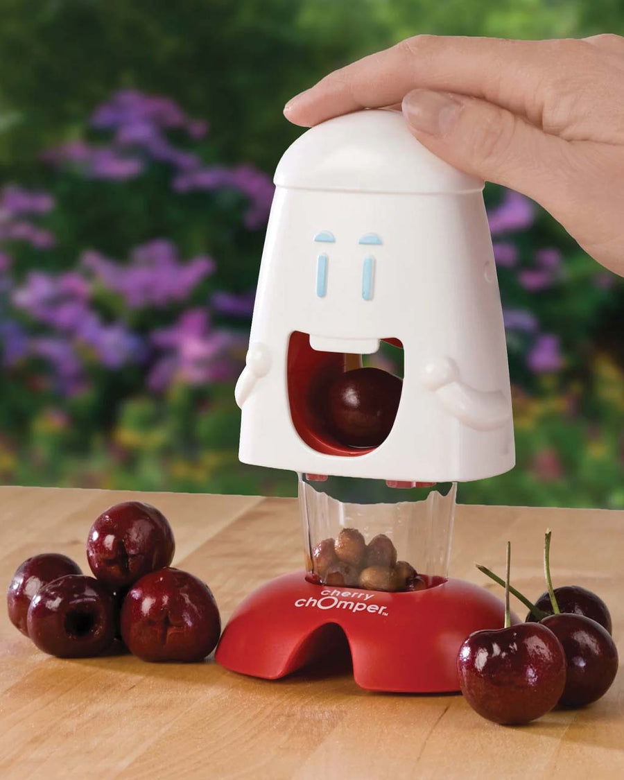 model using cherry chomper cherry pitter with cartoon face