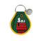 dark green patch keychain with snoopy on his doghouse looking up at a flower