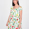 model wearing white mini dress with flowy skirt and colorful floral print
