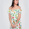model wearing white mini dress with flowy skirt and colorful floral print