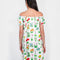 back view of model wearing white mini dress with flowy skirt and colorful floral print