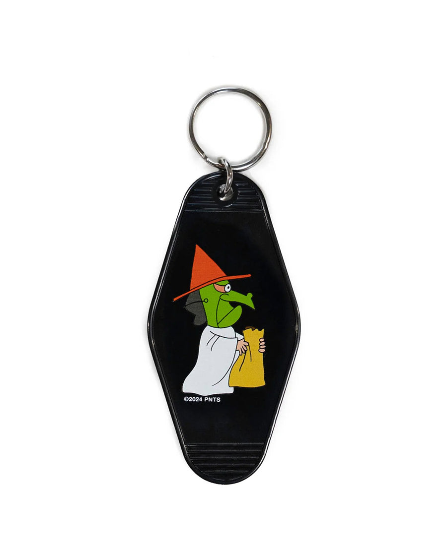 reverse side of black key tag with peanuts character dressed witch holding a treat bag