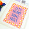 side view of 'let's share some fries' needlepoint kit with embroidery yarn and instructions