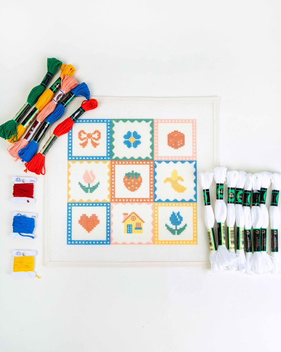 needlepoint kit with colorful embroidery thread and template