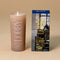 model holding vacation sunscreen lobby candle and box