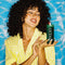 model holding green pool boy pillar candle and box