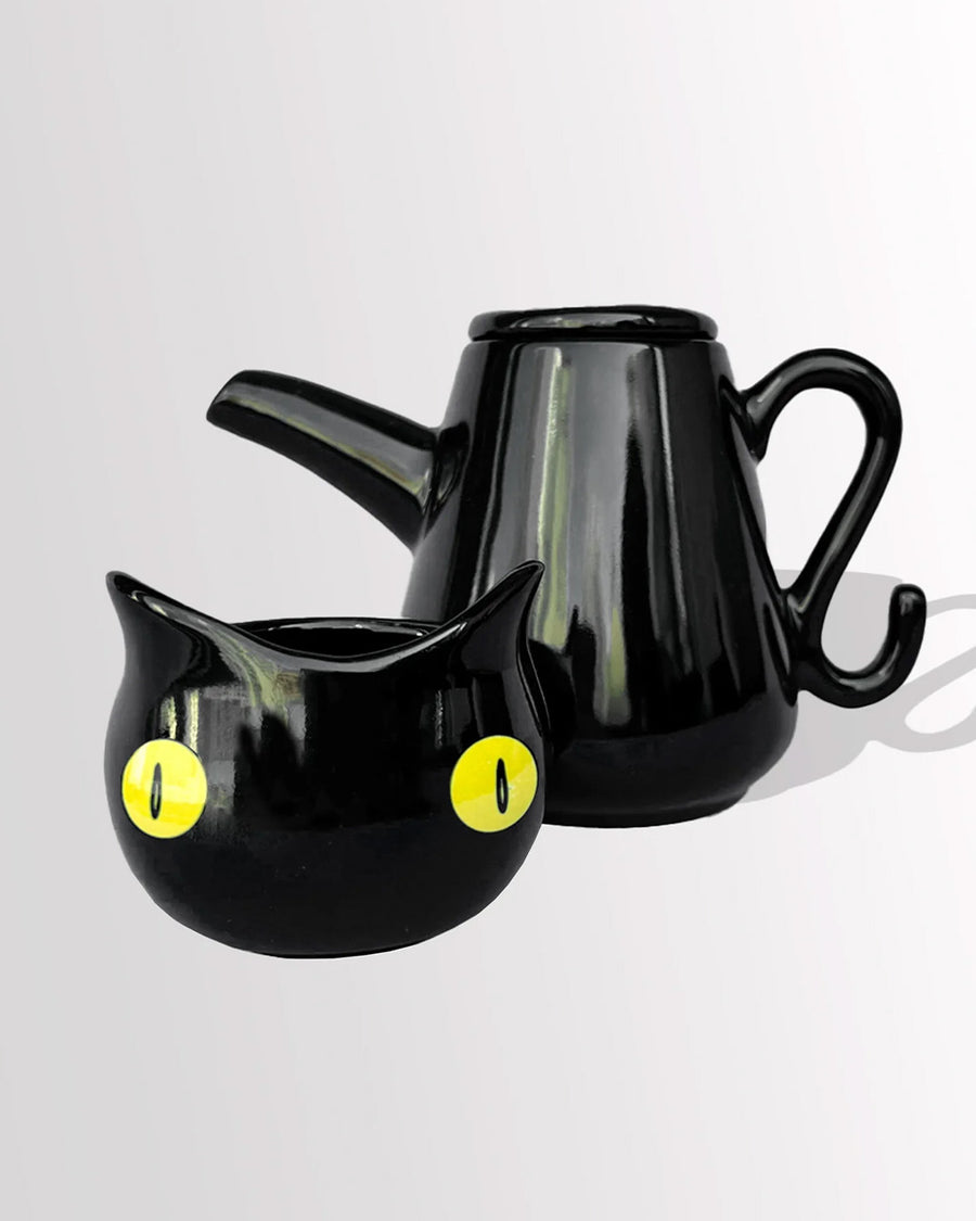 separated black cat tea kettle and cup with removable lid