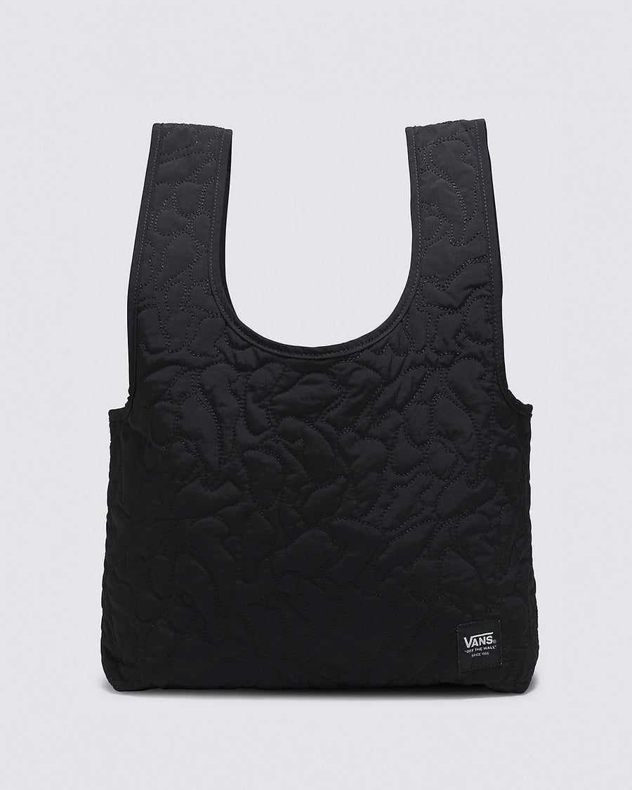 black quilted shopper bag with vans label in the bottom corner