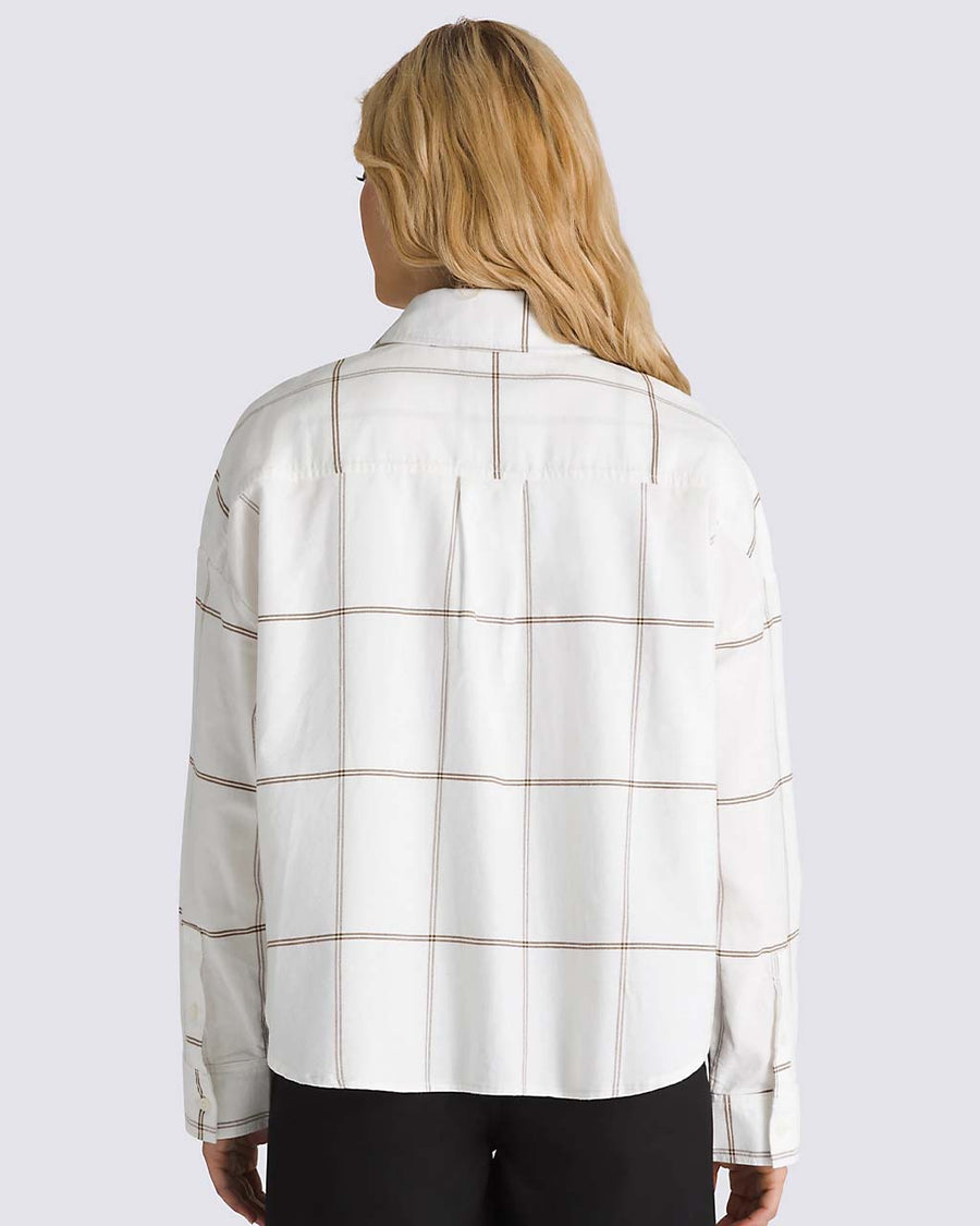 back view of model wearing white oxford style long sleeve shirt with maroon grid plaid