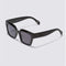 side view of black oversized square sunglasses with blue tint lenses