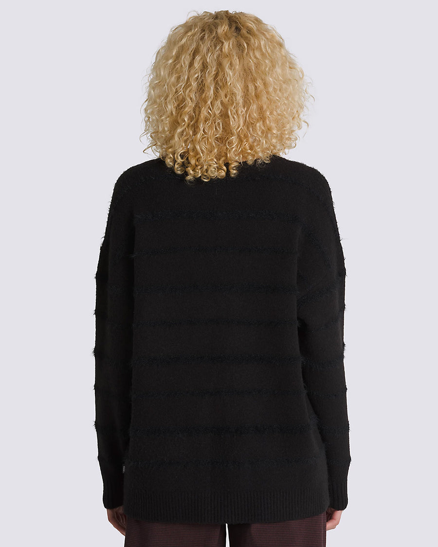 back view of model wearing black relaxed cardigan with eyelash texture