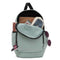 inside of seafoam green backpack with black trim