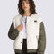 model wearing white sherpa jacket with green quilted sleeves