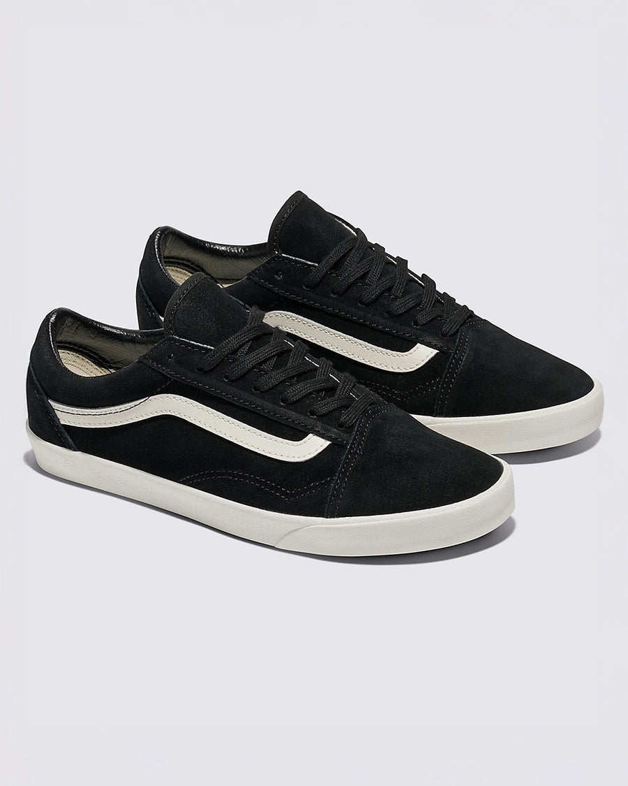 pair of vans black lowpro sneaker with white iconic stripe