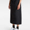 model wearing black midi skirt with elastic waist, button front, and cargo pockets