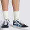 model wearing cream scrunch high crew socks