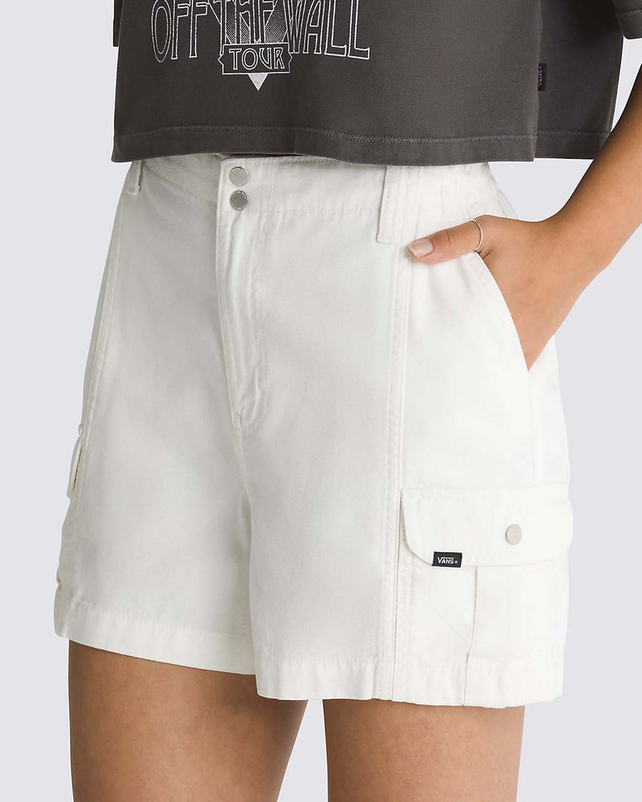 side view of model wearing white 3.5 inch inseam cargo shorts