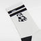 up close of white crew socks with black stripes and panda print