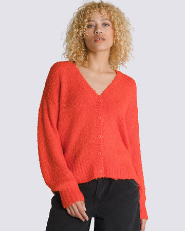 model wearing red boucle relaxed fit cardigan