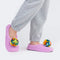 model wearing lilac knitted slip on slipper socks with rainbow pom