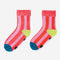 pink striped socks with yellow and blue trim and non-slip bottom