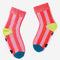 pink striped socks with yellow and blue trim and non-slip bottom