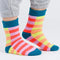 model wearing multicolor stripe ribbed socks