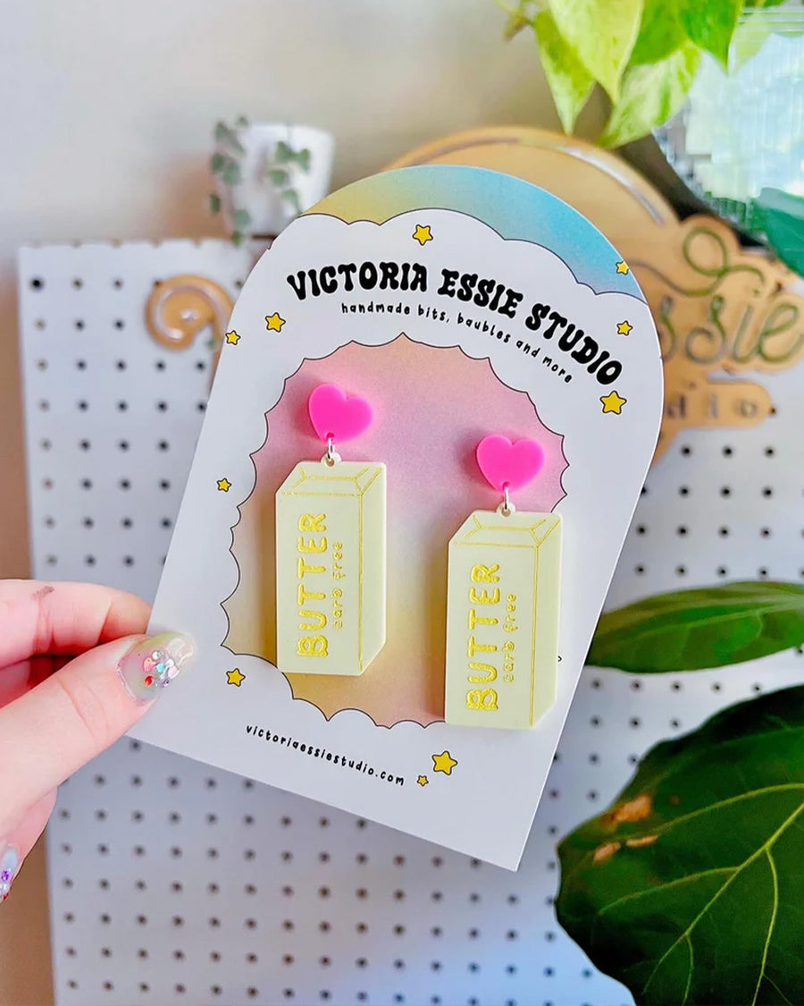 up close of stick of butter dangle earrings