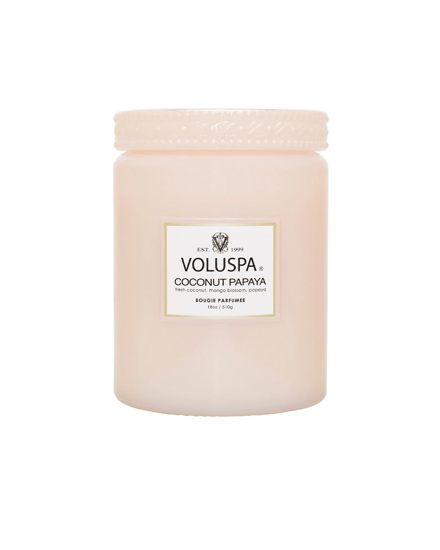 large 18oz. coconut papaya scented candle in a light pink embossed vessel