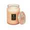 large 18oz. watermelon scented candle in a coral embossed vessel with the lid off