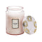 large 18oz. panjore lychee scented candle in a light pink embossed vessel with the lid off