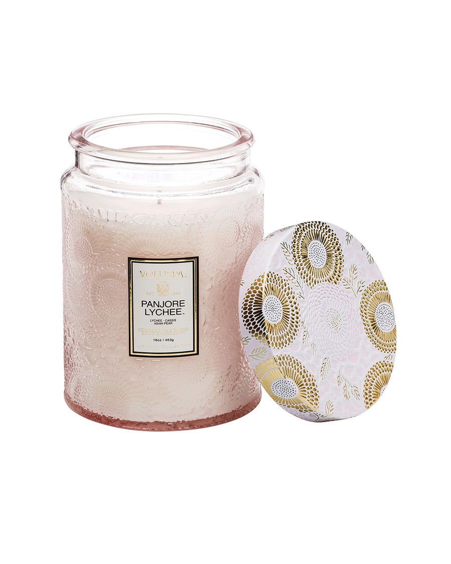 large 18oz. panjore lychee scented candle in a light pink embossed vessel with the lid off