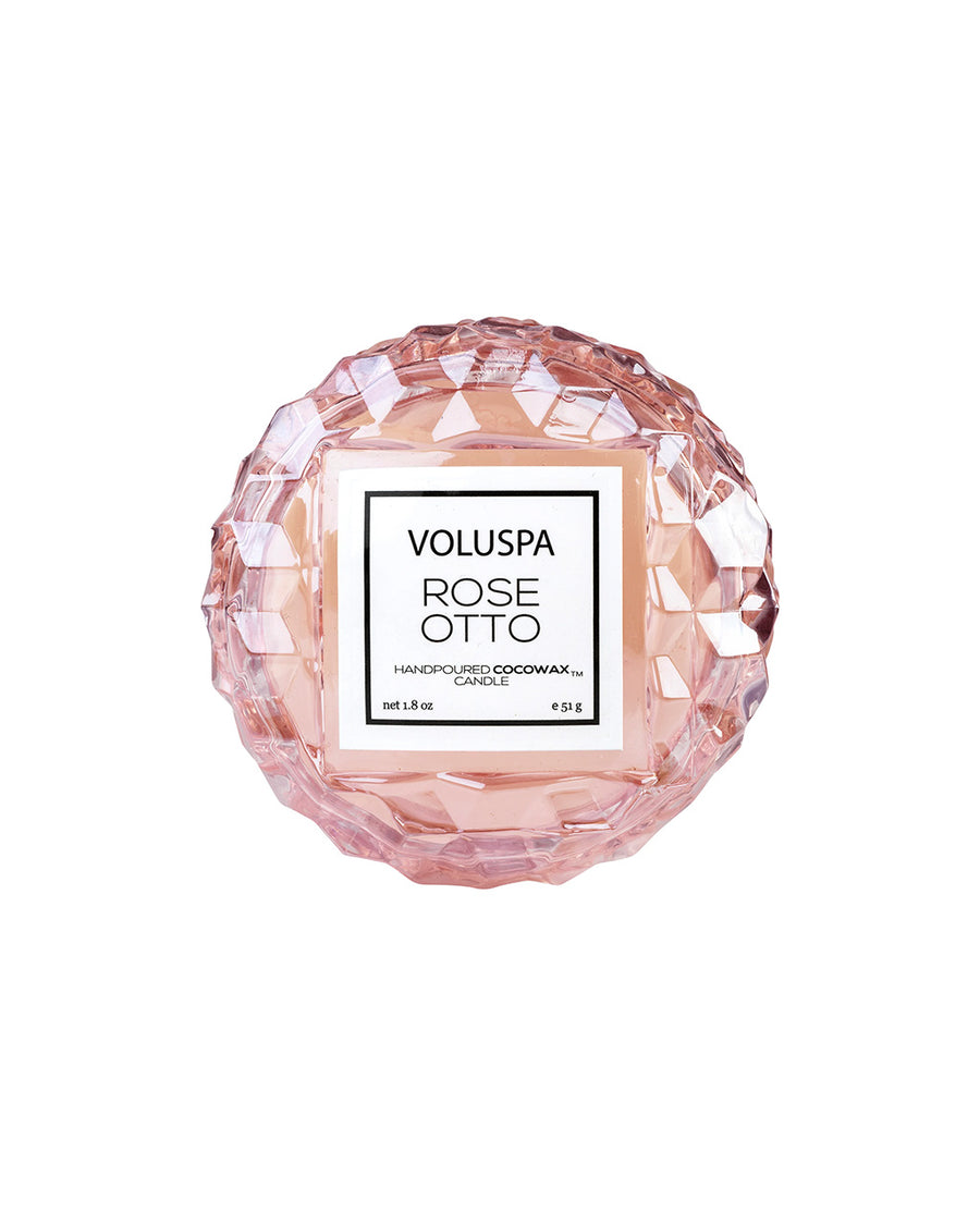 top view of light pink macaron shaped candle in a rose otto scent