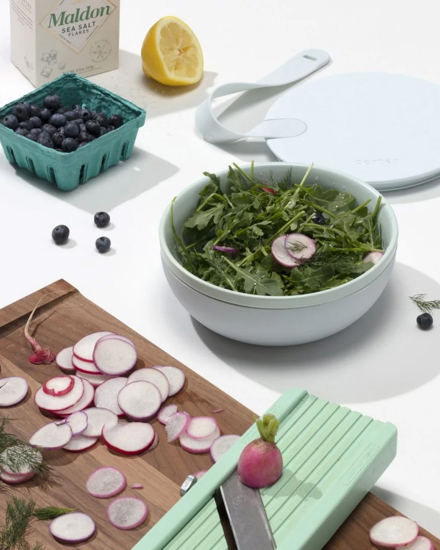 mint ceramic lunch bowl with salad inside