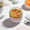 24 oz pink seal tight glass bowl with lid with soup inside
