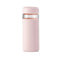 glass wide mouth water bottle with blush silicone grip sleeve and matching lid