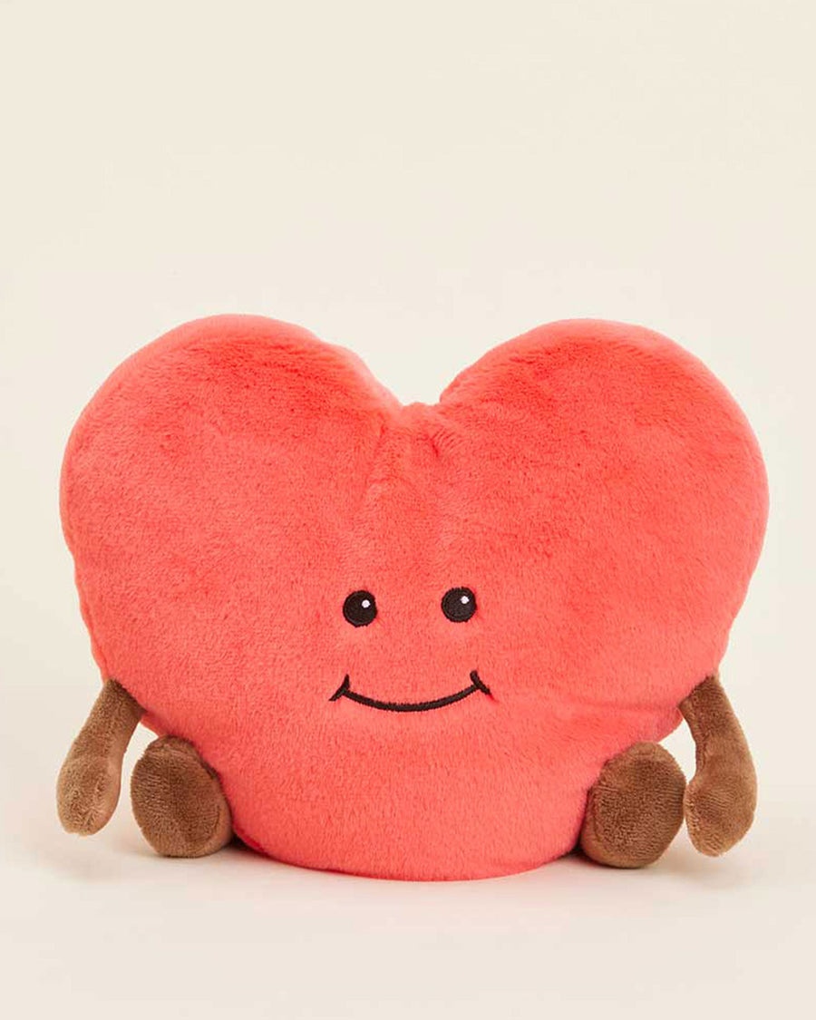 pink heart-shaped plush toy with brown arms and legs