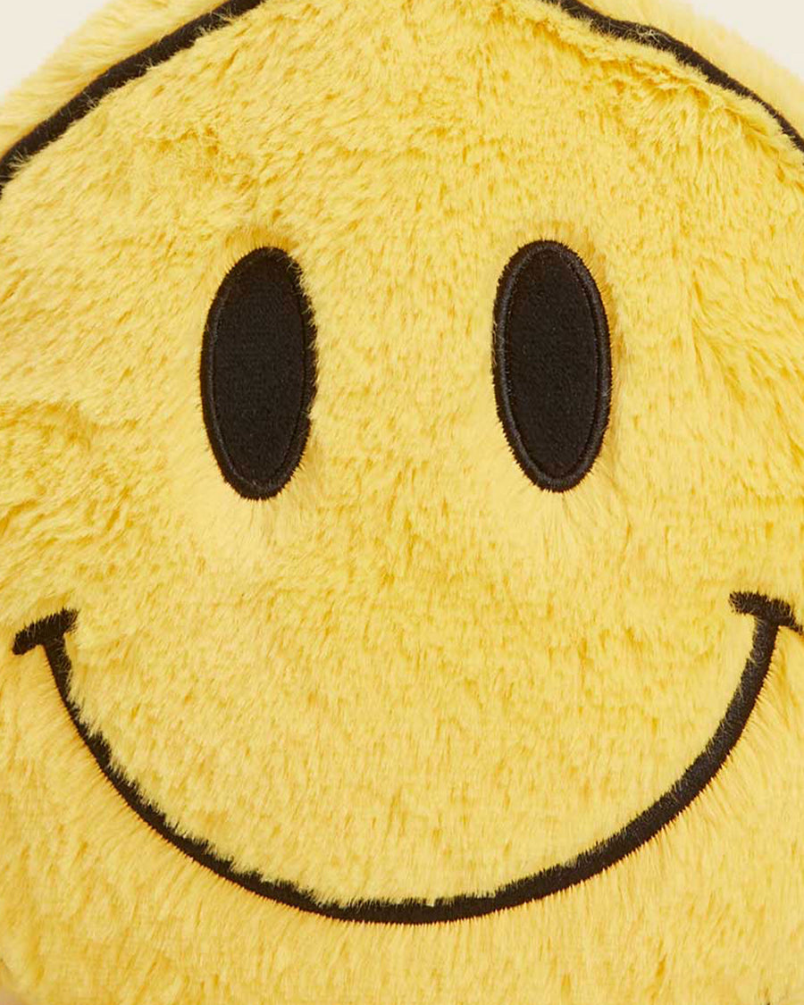 up close of smiley shaped microwavable heating plush