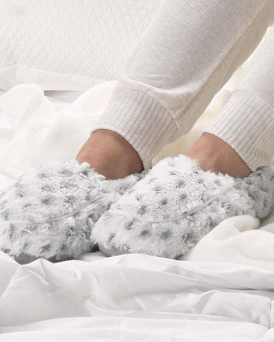 model wearing white slippers with grey spots