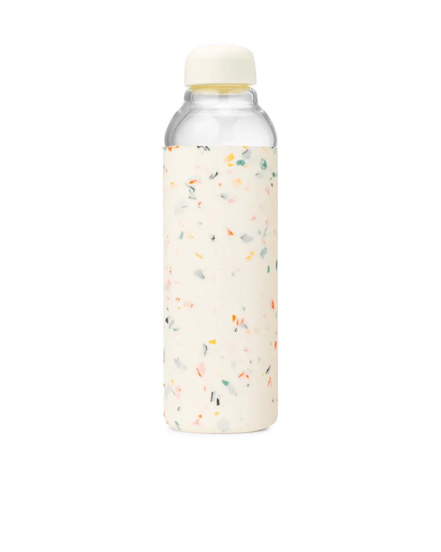 back view of 20 oz. glass water bottle with white terrazzo silicone cover