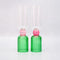 set of 2 bar glasses with green base and pink center detail