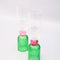 set of 2 bar glasses with green base and pink center detail