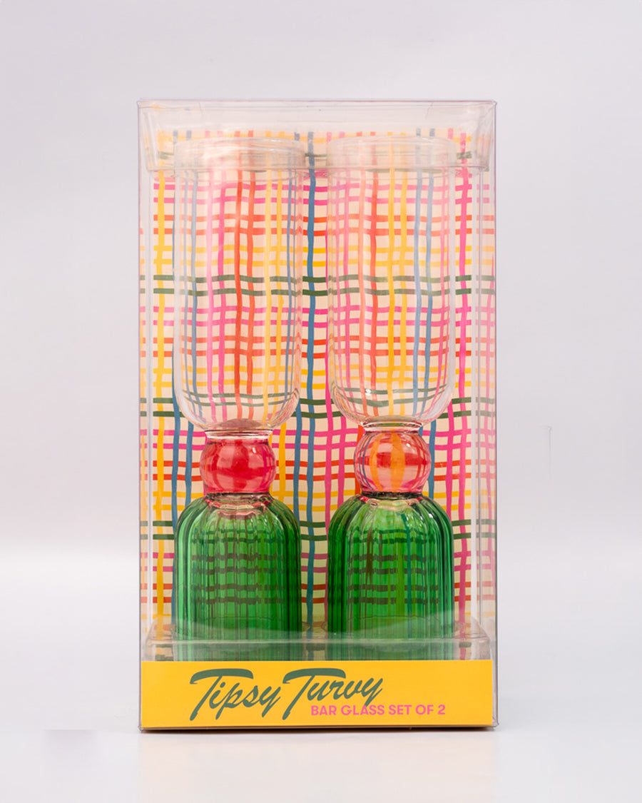 packaged set of 2 bar glasses with green base and pink center detail
