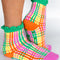 model wearing multicolor grid print chenille socks with green riffle and grip bottoms