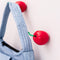 set of 2 cherry shaped hooks on a wall with a bag hanging from one