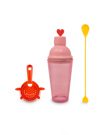 pink bar shaker with red heart top, red strainer, and yellow stirring stick